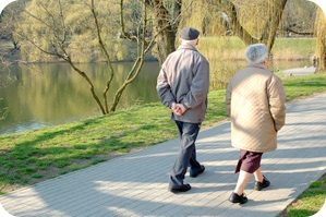 Elderly couple walking in the park.